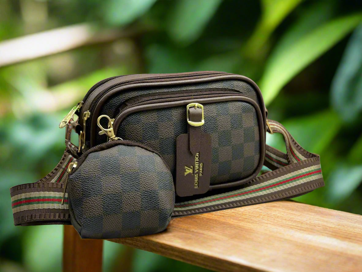 Brown checkered bag with a smaller matching pouch on a gray background