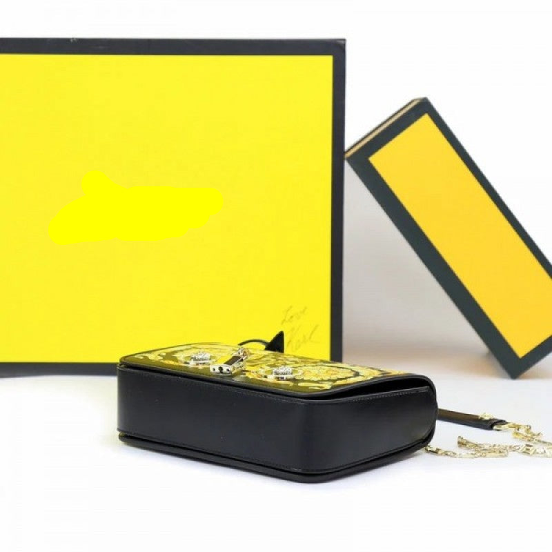 Flower medusa Versace handbag with gold chain and yellow background