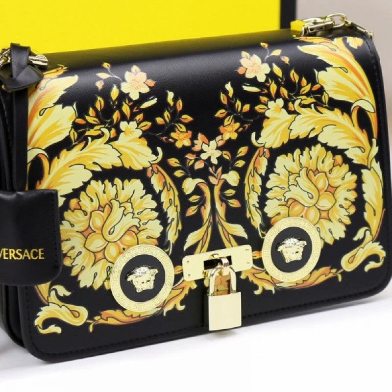 Flower medusa Versace handbag with gold floral pattern on a white background