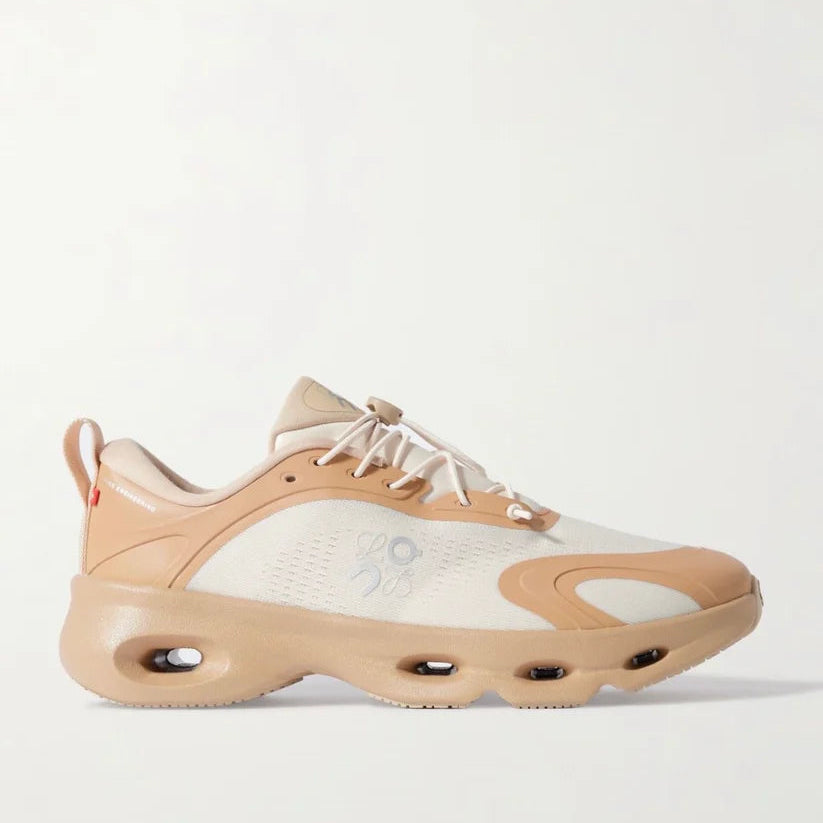 Beige and white sneaker on a light gray background