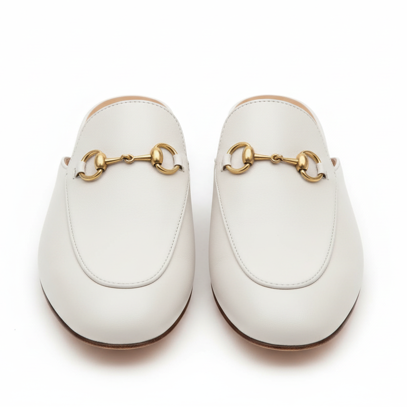 Off white Gucci Mules  with gold accents on a light gray background