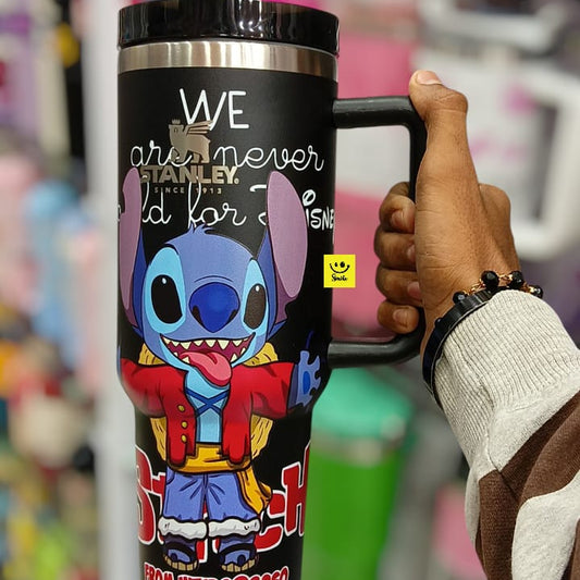 Person holding a tumbler with a character design and text in a store setting