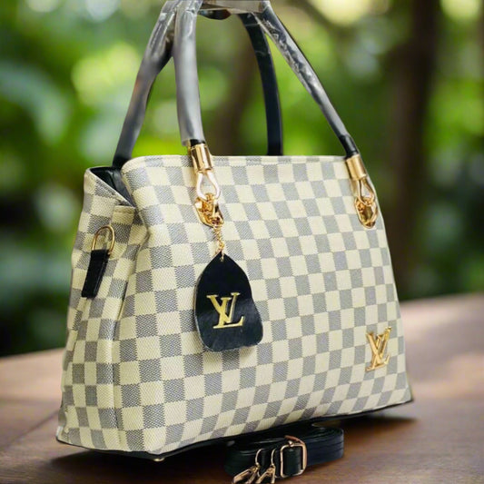 Louis Vuitton handbag with checkered pattern on a dark surface