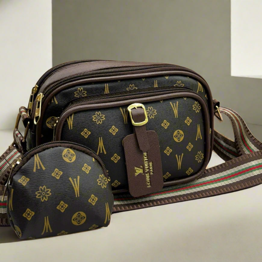 Designer handbag with matching pouch on a light background