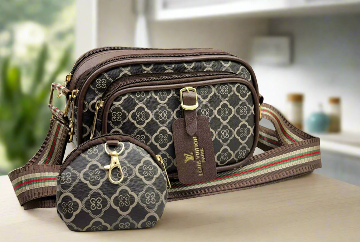 Louis Vuitton handbag and wallet set on a table with a blurred background
