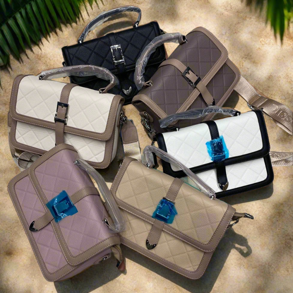 Collection of handbags on a marble surface