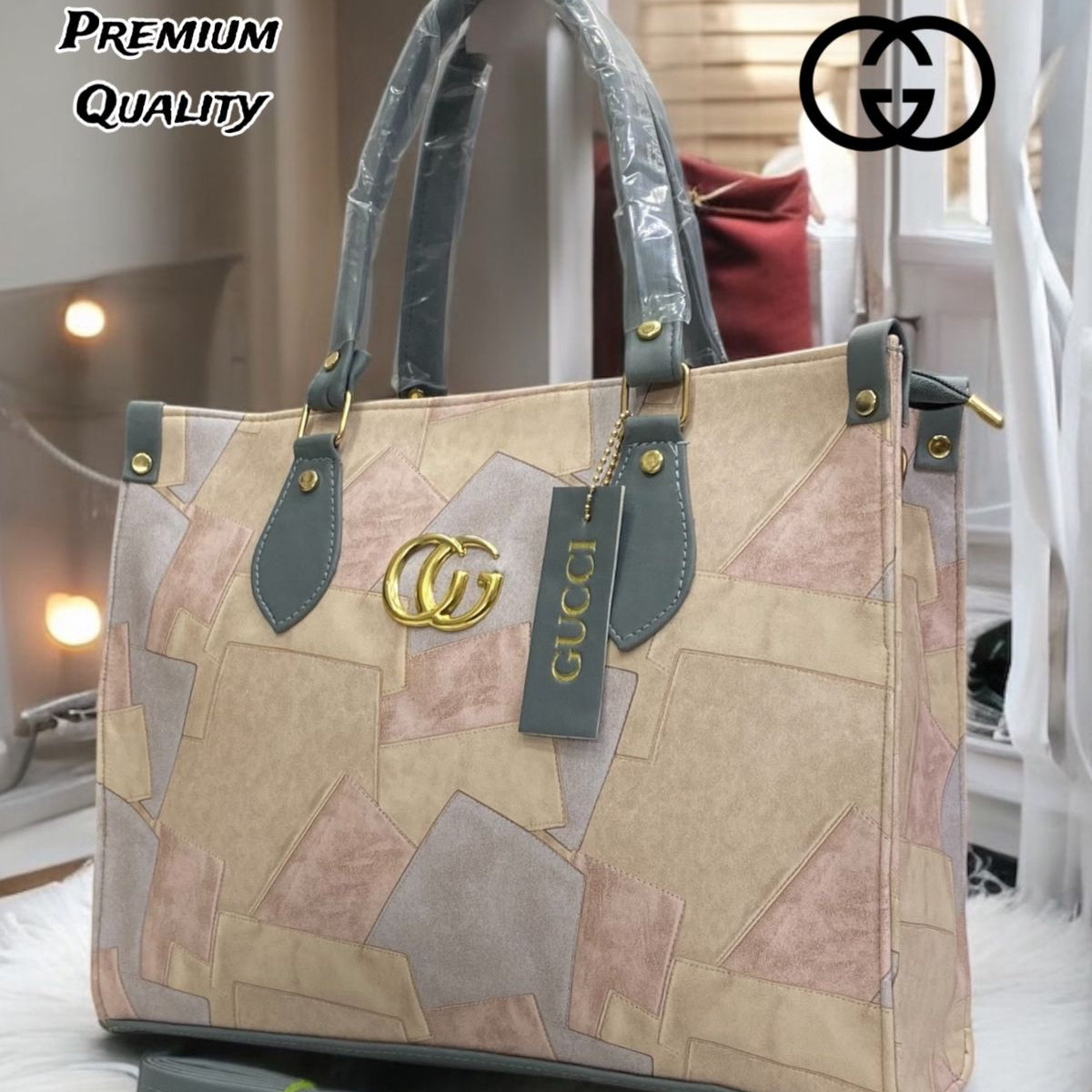Gucci handbag with patchwork design on a soft surface, brand logo visible