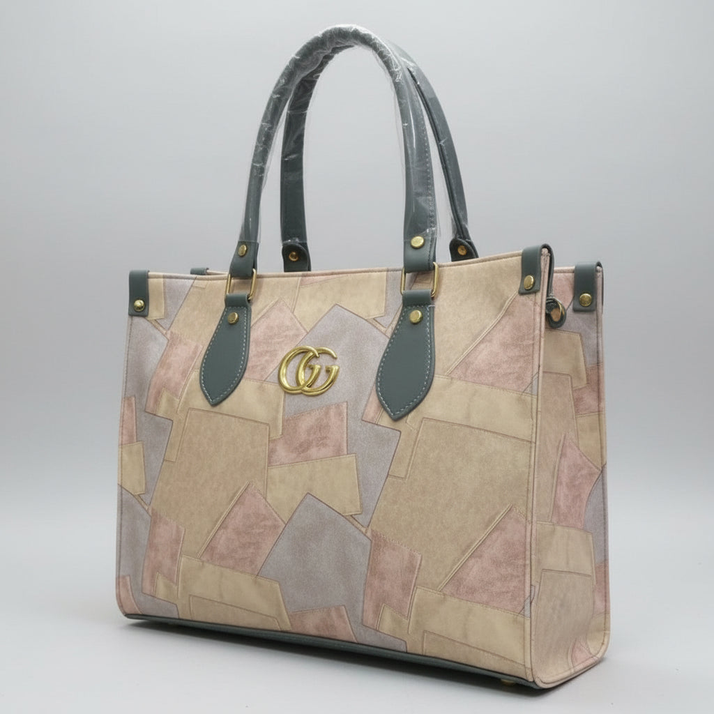 Gucci handbag with patchwork design on a soft surface, brand logo visible