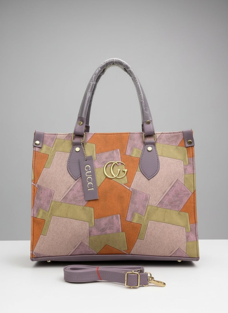Gucci handbag with patchwork design on a neutral background