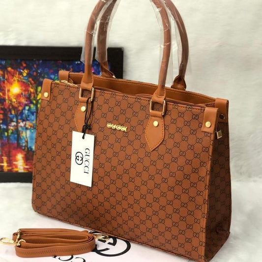 Brown patterned handbag with a visible brand tag on a light background