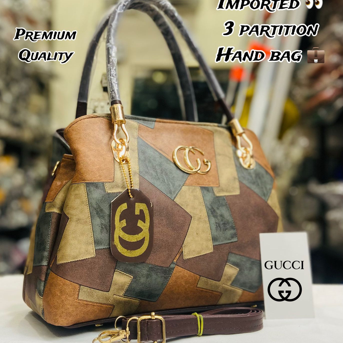 Multicolored handbag with gold accents and Gucci logo on a blurred background