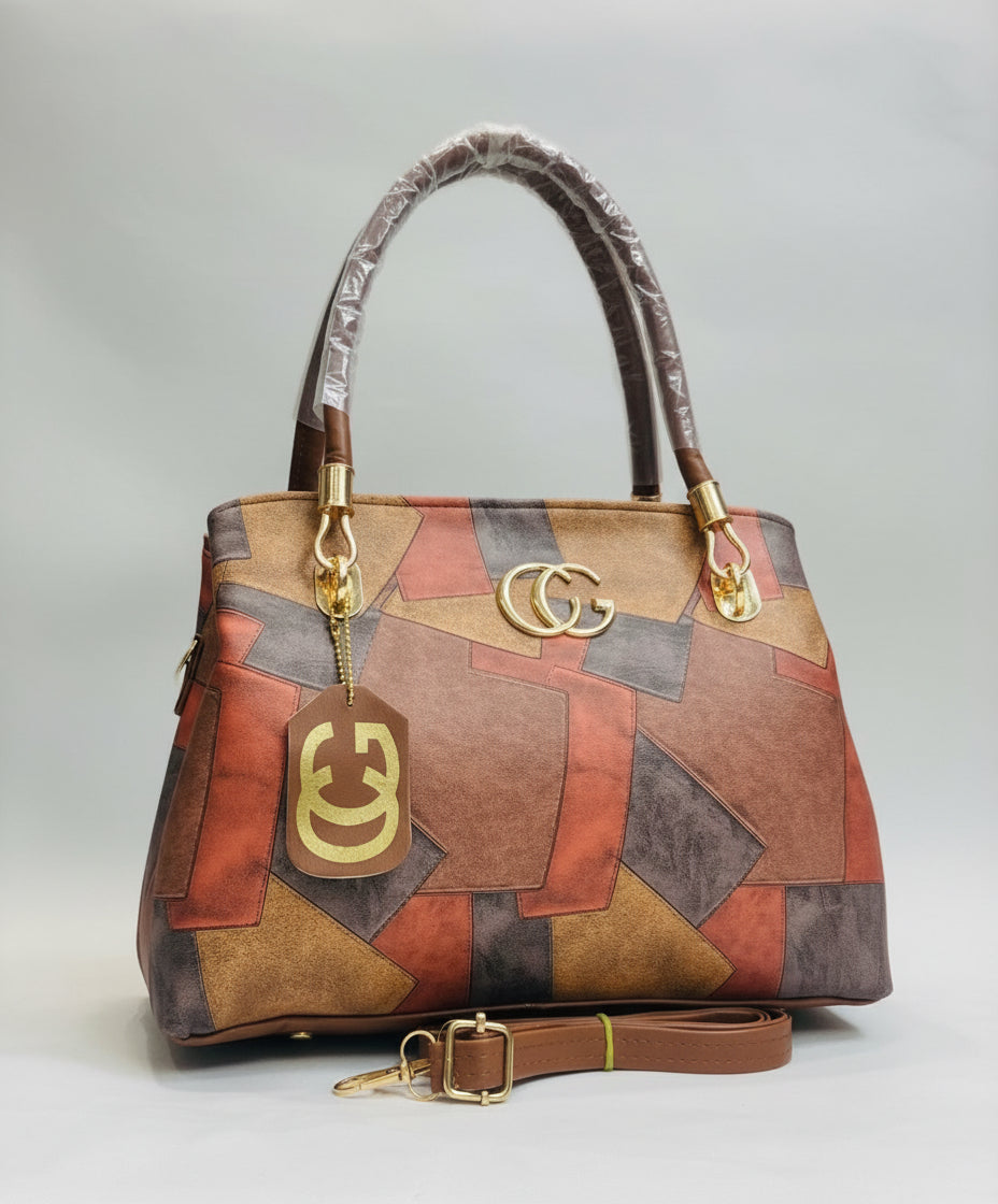 Multicolored handbag with Gucci logo on a blurred background