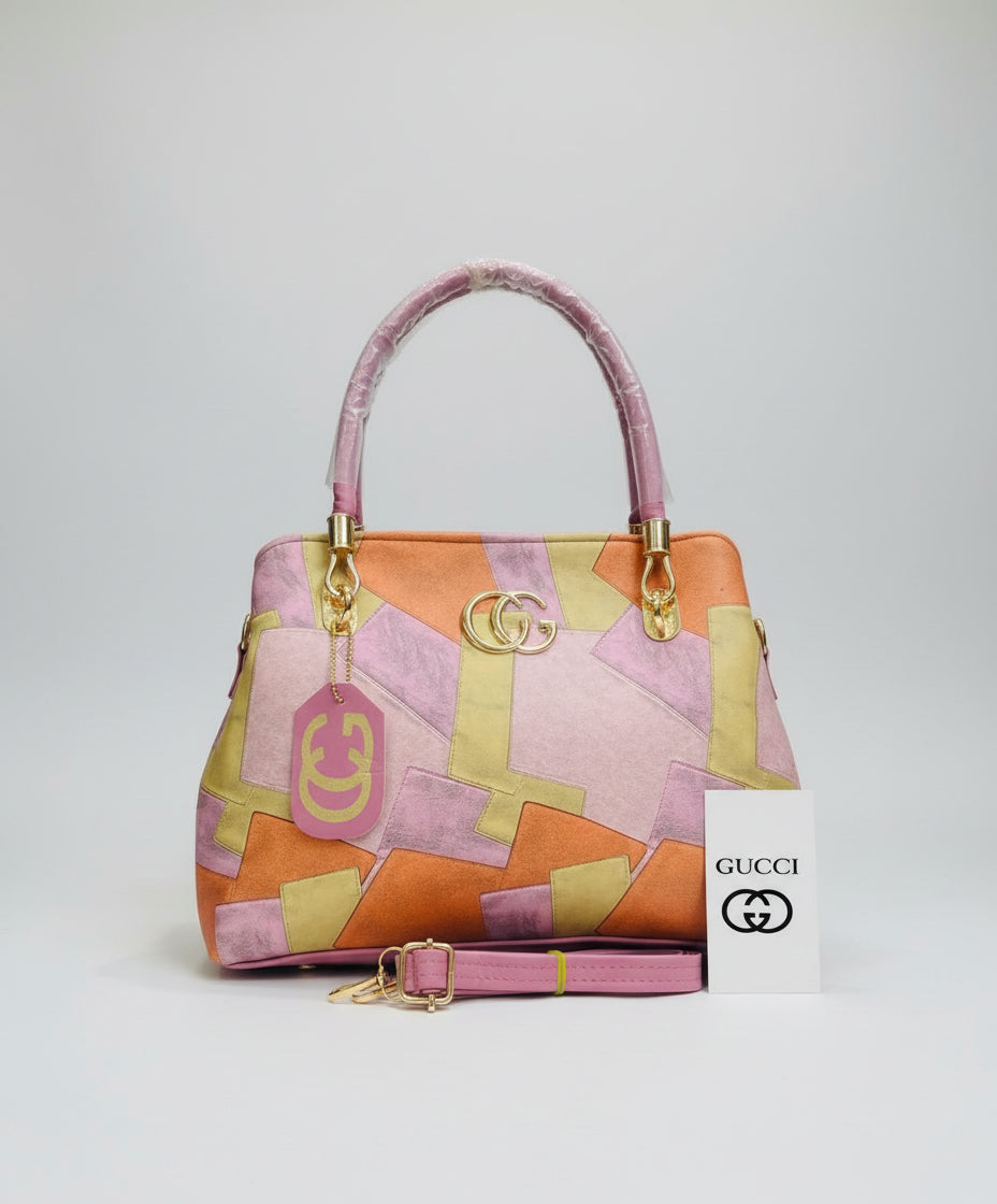 Colorful handbag with gold accents and Gucci logo on a blurred background