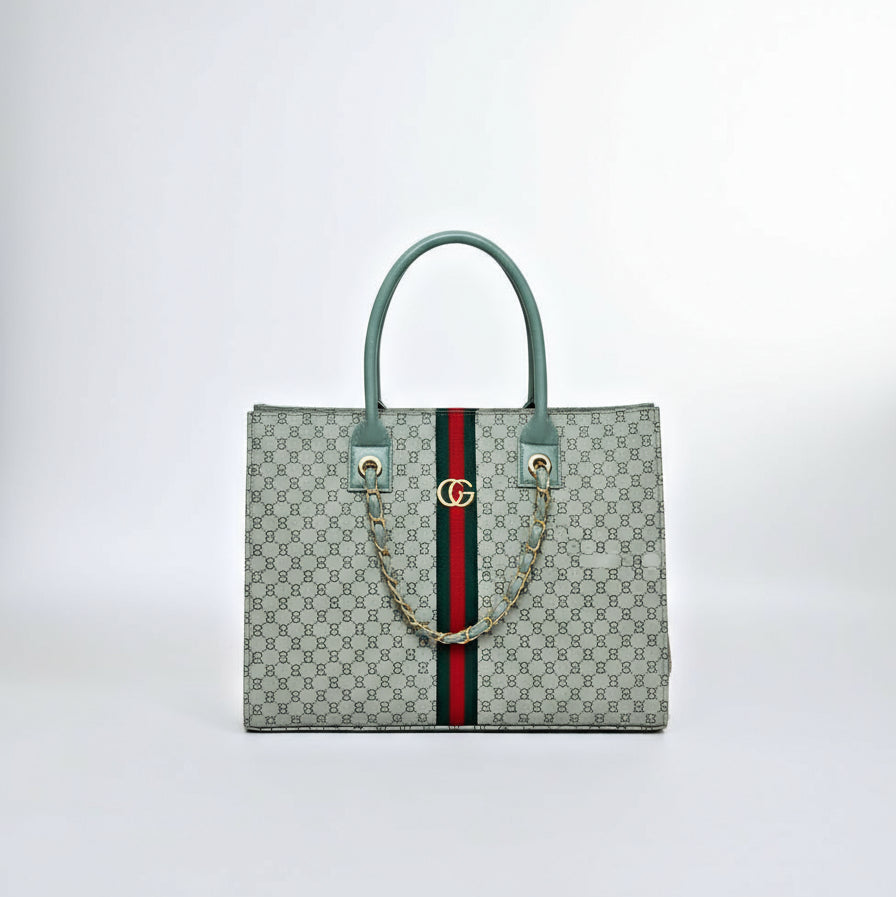 Gucci handbag with a person wearing brown boots on a white background