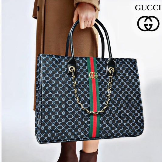 Person holding a Gucci handbag with a visible brand logo on a white background