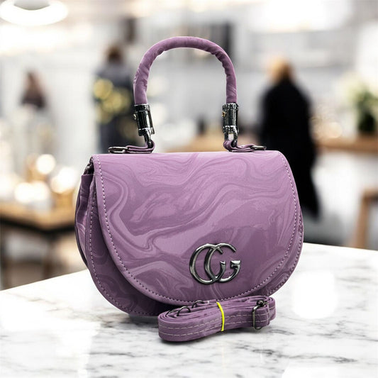 Purple handbag with a brand logo on a marble surface