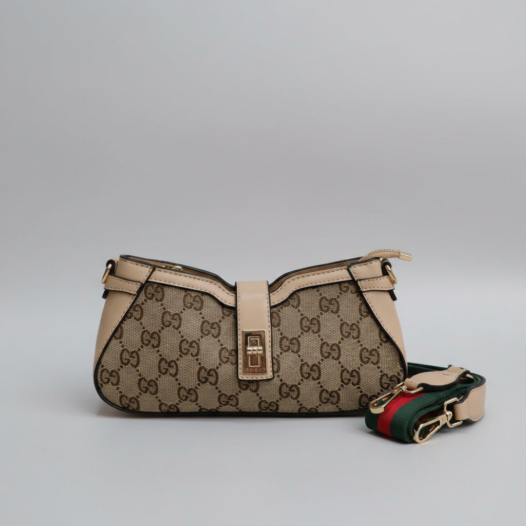 Beige Gucci handbag with monogram pattern on a white surface
