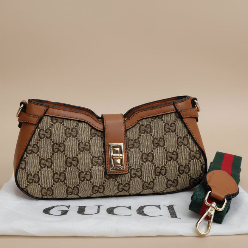 Brown Gucci Moon Side Mini Sling Bag handbag with monogram pattern and brown leather accents on a beige background