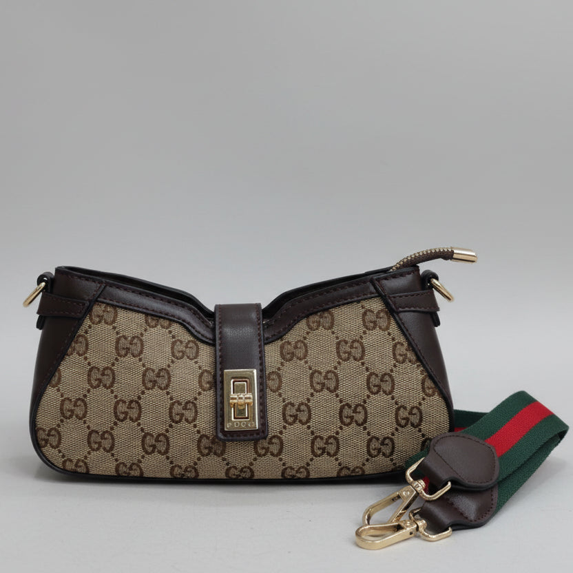 Tan Gucci Moon Side Mini Sling Bag Designer handbag with patterned fabric and leather accents on a gray background
