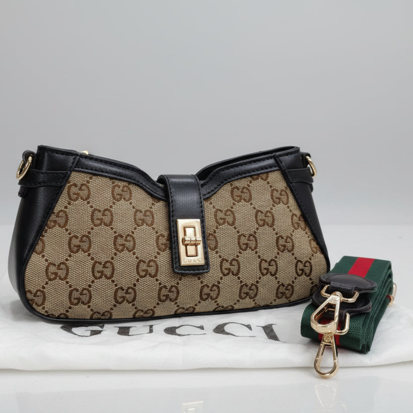 Black Gucci Moon Side Mini Sling Bag Gucci handbag with monogram pattern and detachable strap on a light gray background