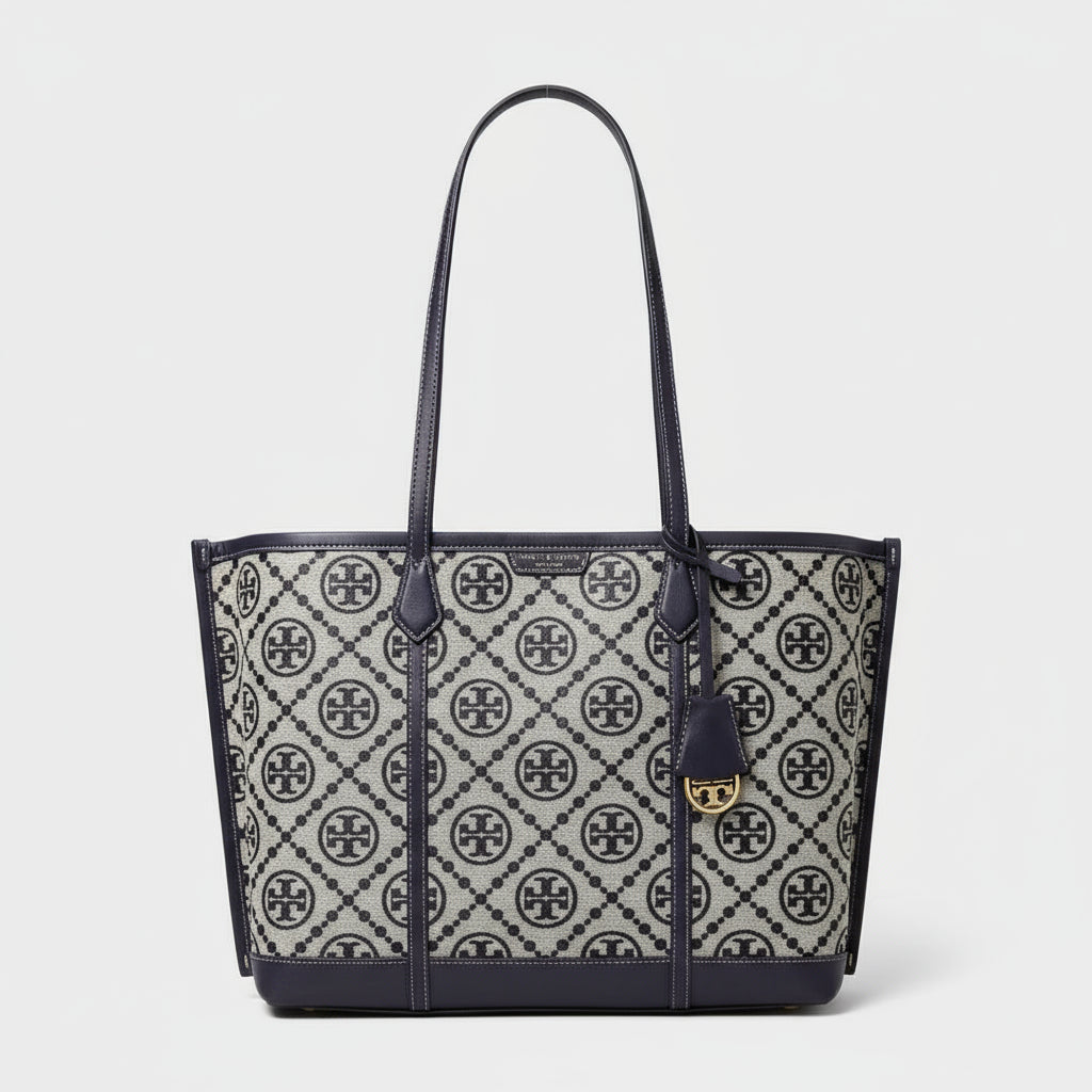 Tory Burch handbag with logo pattern on a white background