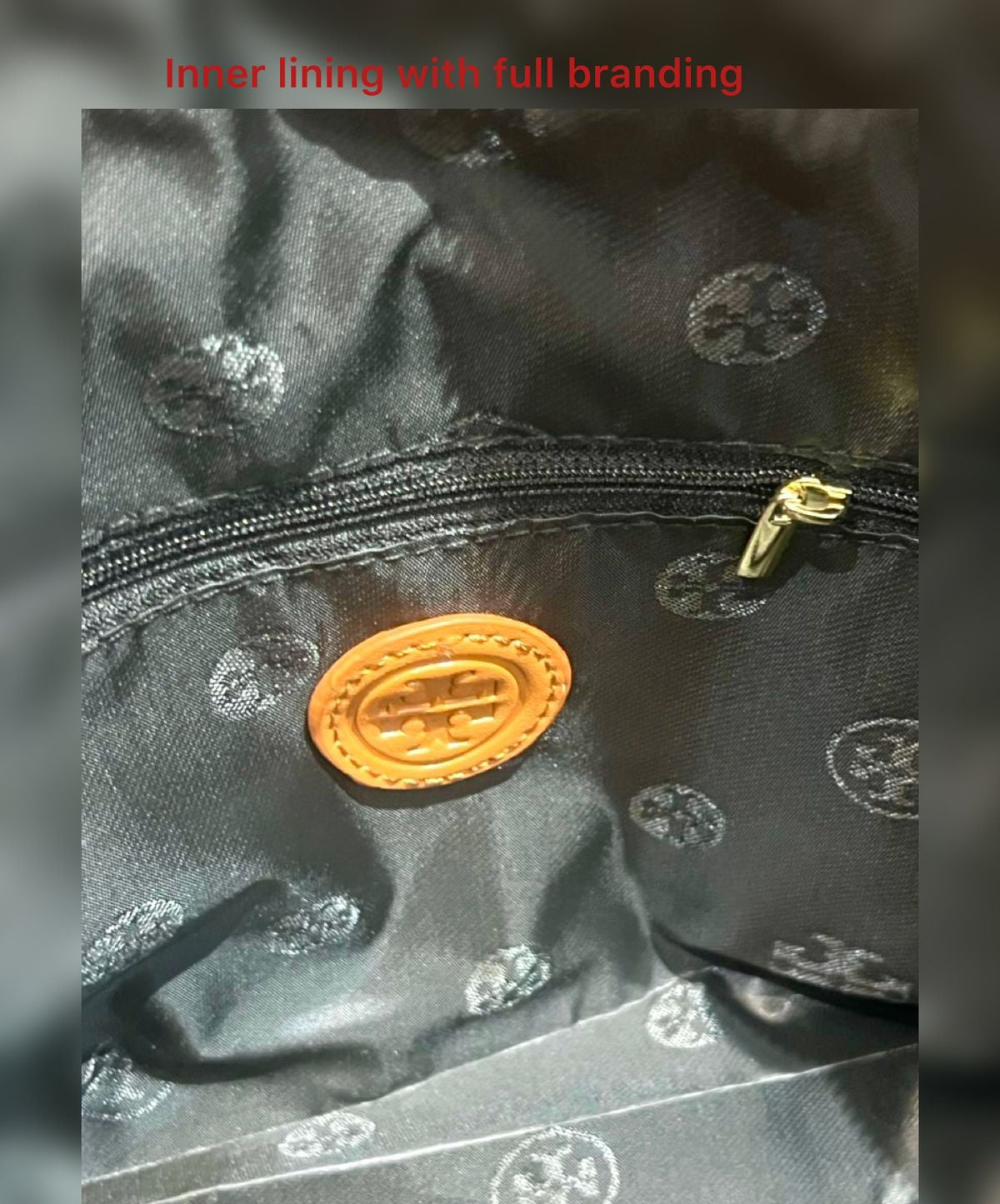 Close-up of a black fabric inner lining with gold branding logo and 'A+V' logo.