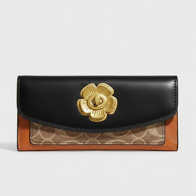 Coach wallet with gold flower emblem on an open magazine