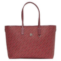 Red handbag with a subtle pattern on a white background