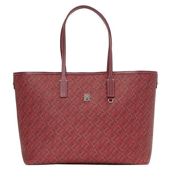 Red handbag with a subtle pattern on a white background