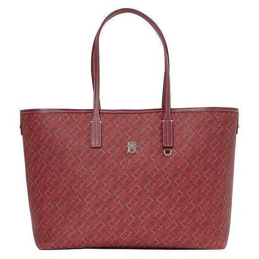 Red handbag with a subtle pattern on a white background