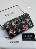 Black Guess Women’s Long Wallet Floral-patterned wallet with Guess branding on a white background