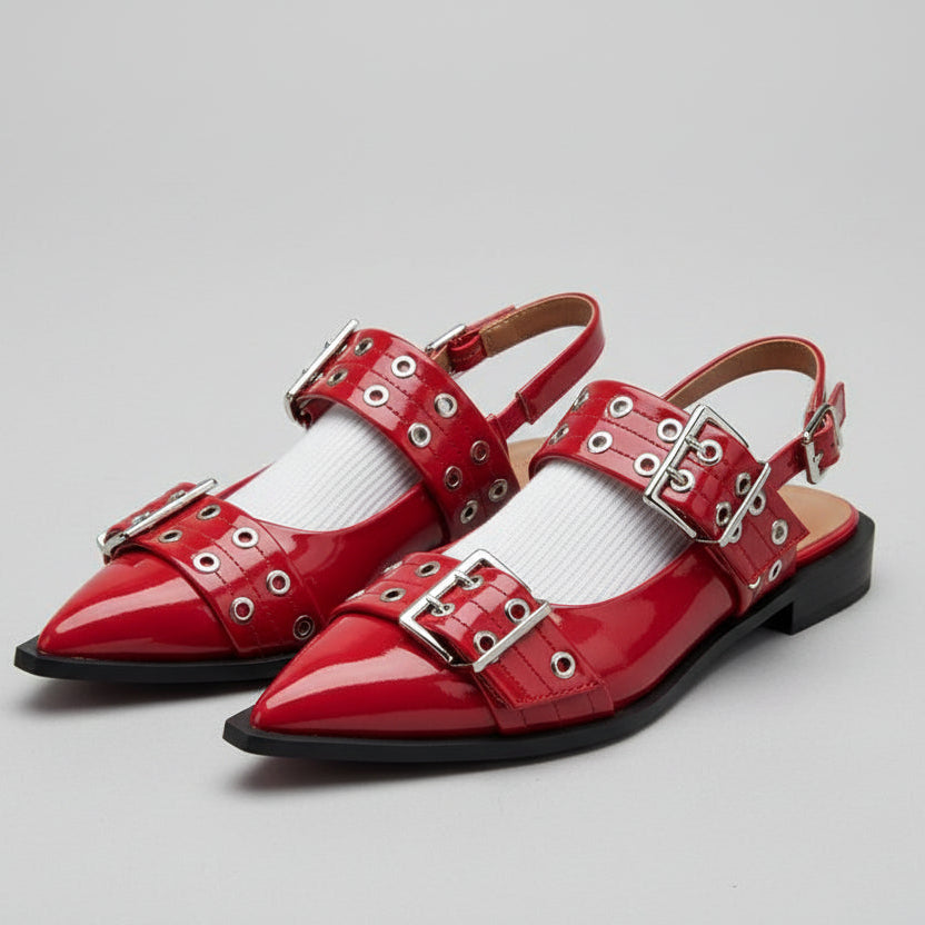 Red CHLOÉ Western Look Footwear shoes with metal buckles worn inside a car.