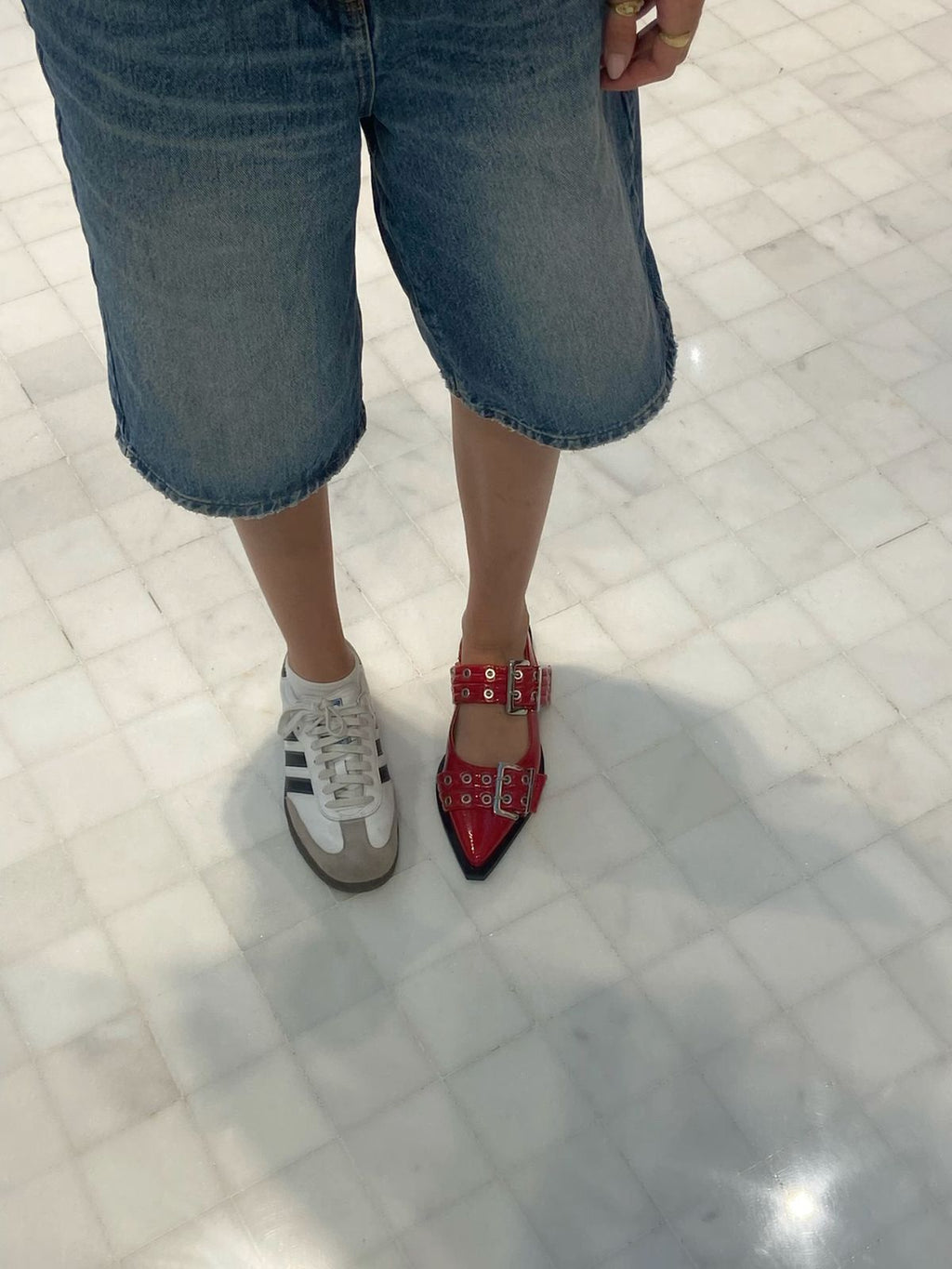 Red CHLOÉ Western Look Footwear  Person wearing red shoes with white laces on a tiled floor