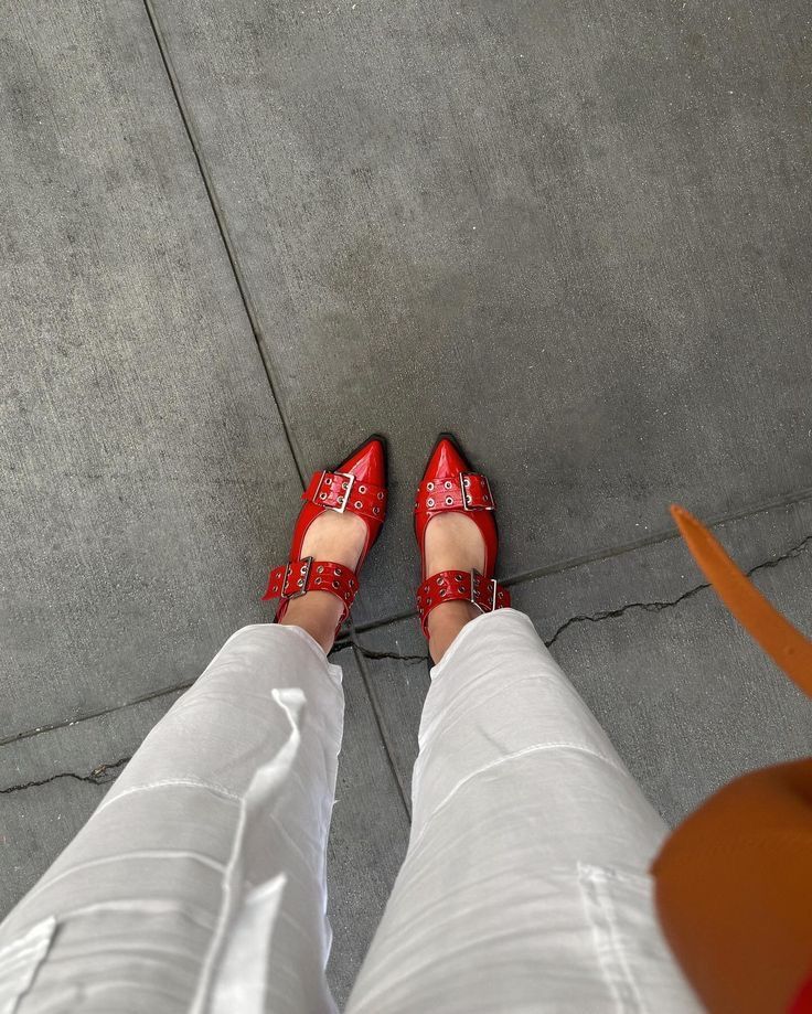 Red CHLOÉ Western Look Footwear  high-heeled shoes with buckles on a gray pavement