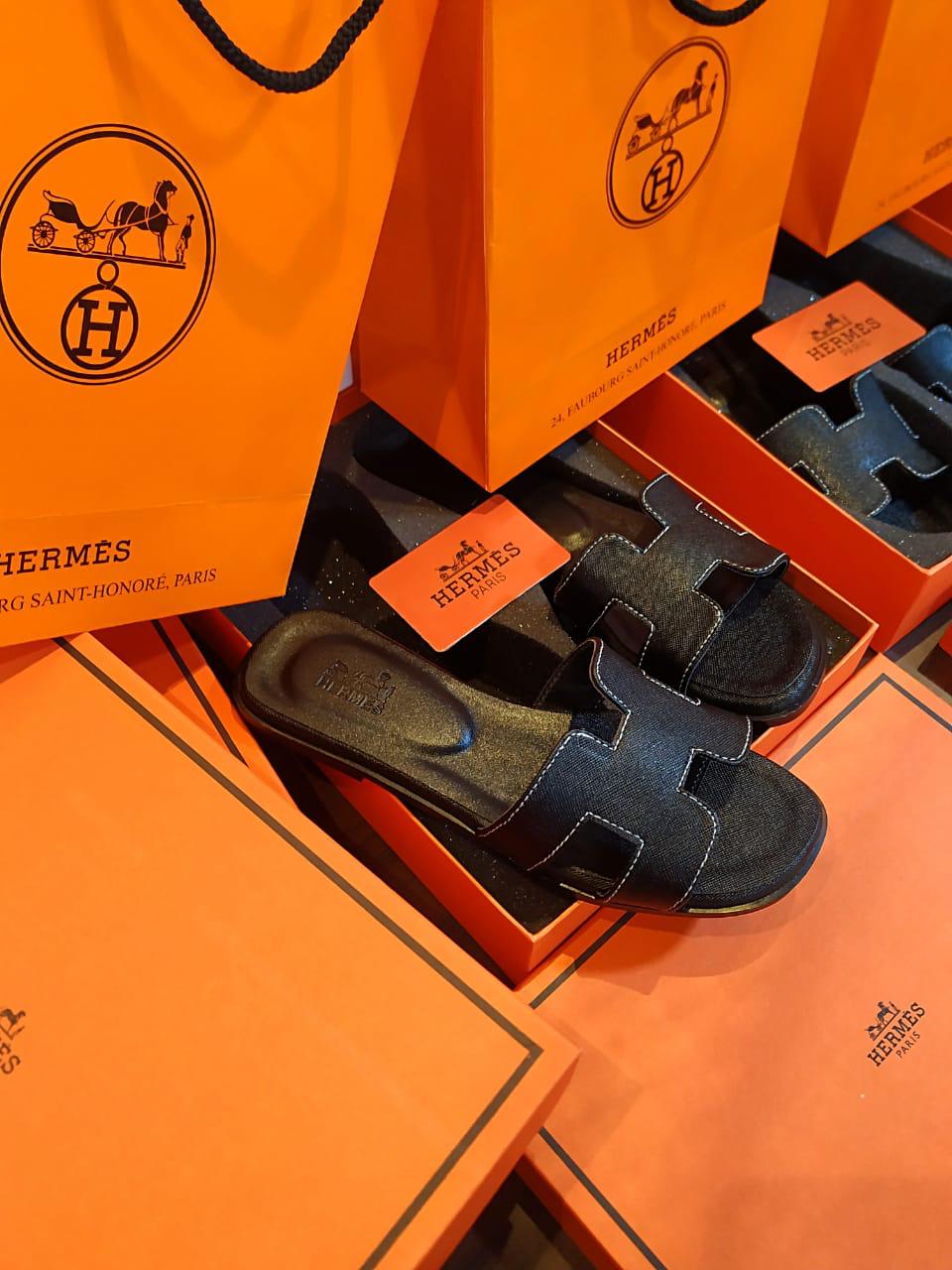 Black HERMES Oran Velvet women   Hermes sandals on orange boxes with the brand logo.