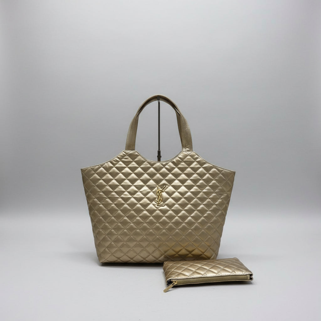 Brown YSL Big Size Tote Bag with Small Wallet quilted handbag with a matching pouch on a light wooden surface.