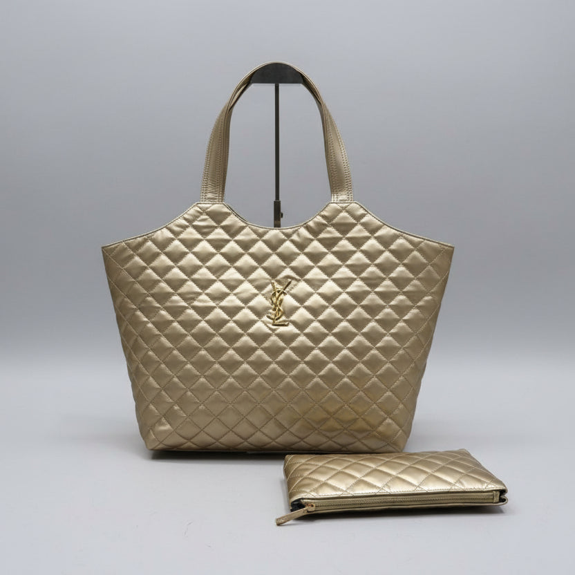 Beige YSL Big Size Tote Bag with Small Wallet quilted handbag with a matching pouch on a light wooden surface.