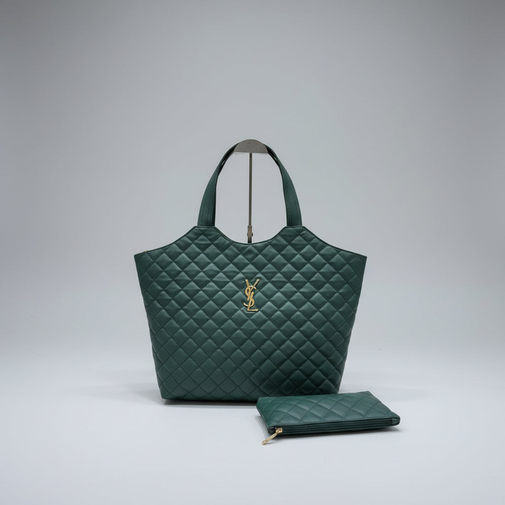 Teal YSL Big Size Tote Bag with Small Wallet quilted handbag with a brand logo on a wooden surface and white textured wall background