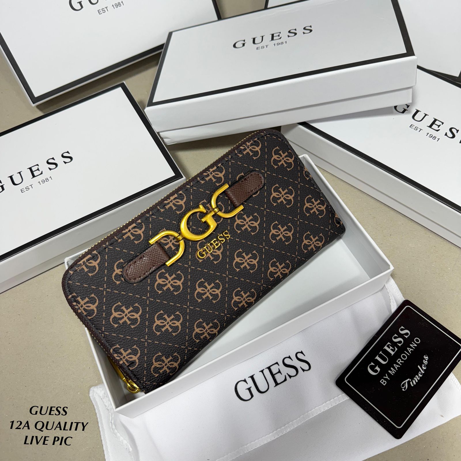 Tan Premium Guess Big Size Zipper Wallet Guess wallet with logo in a box on a beige surface