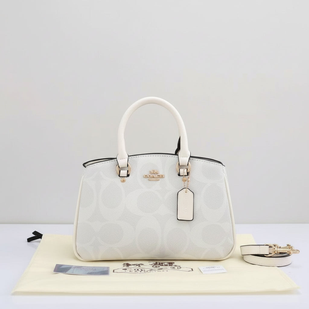 White Coach Savannah Carryall Bag  Coach handbag with logo on a light background