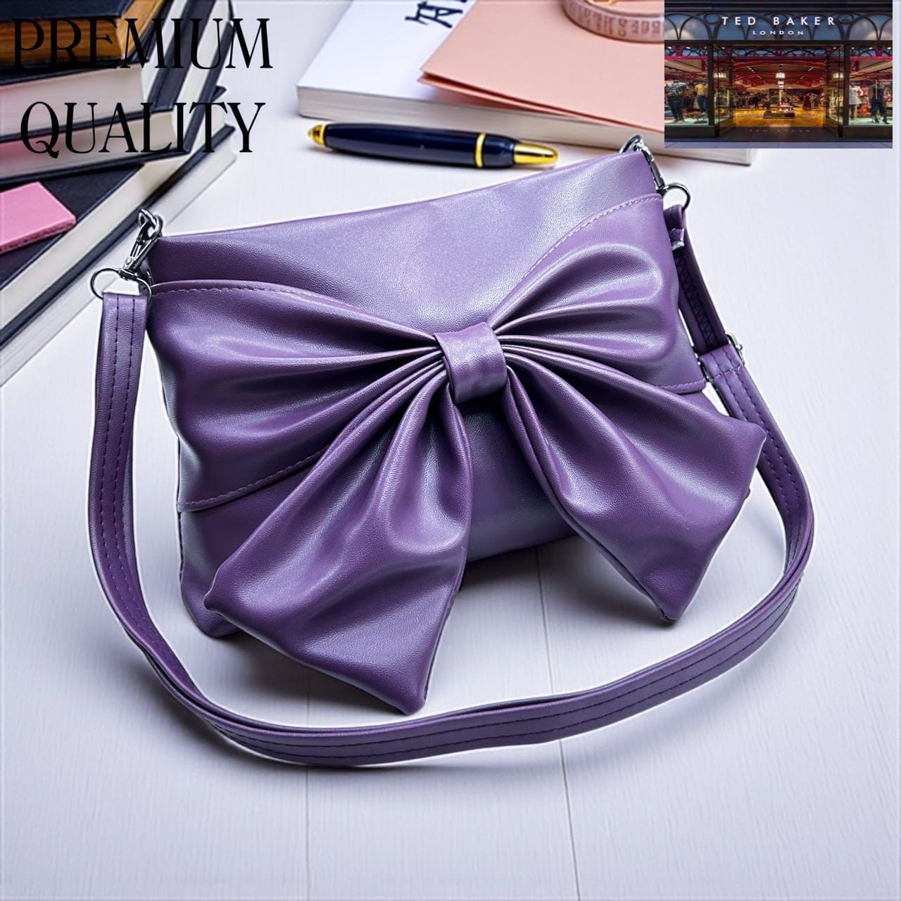Purple TED BAKER London Premium Sling Bag handbag with a large bow on a light surface