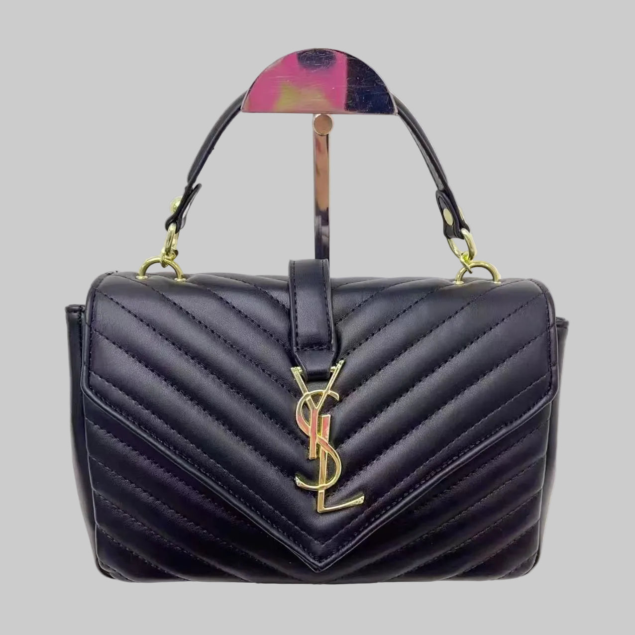 Black YSL Saint Laurent Sling Bag quilted handbag with a brand logo on a white background