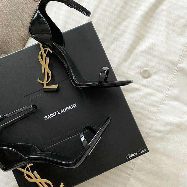YSL High Heel Sandals for Women Black high-heeled shoes on a Saint Laurent box with a white background