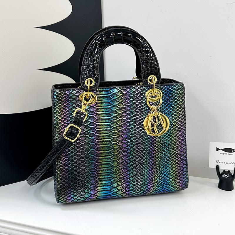 Black Lady Dior Premium Handbag handbag with gold hardware on a white surface