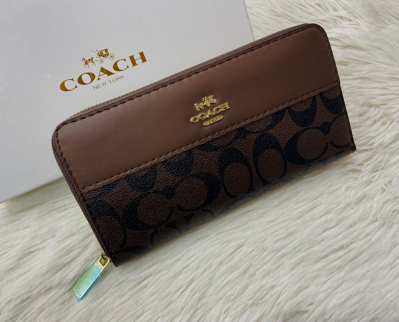 Tan Coach High-Quality Handy Wallet Coach wallet with logo on a light background