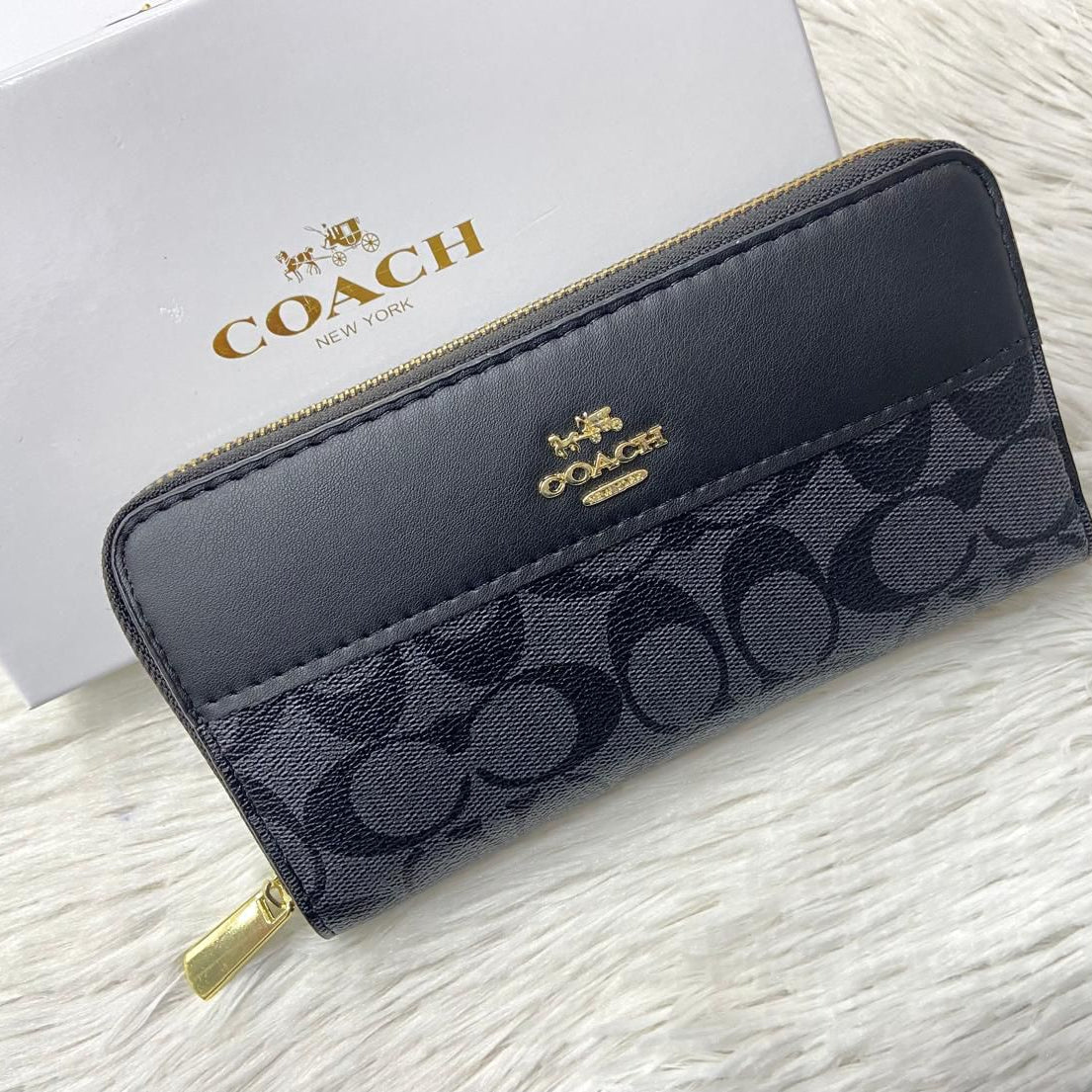 Black Coach High-Quality Handy Wallet Coach wallet with logo on a light gray background