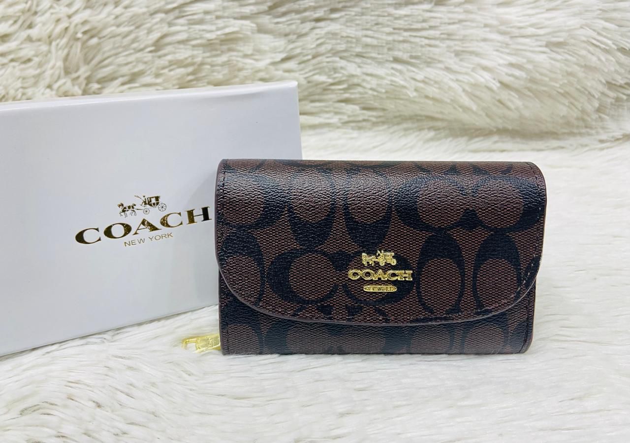 Tan Coach Premium Quality Leather Wallet Coach wallet with logo on a white surface