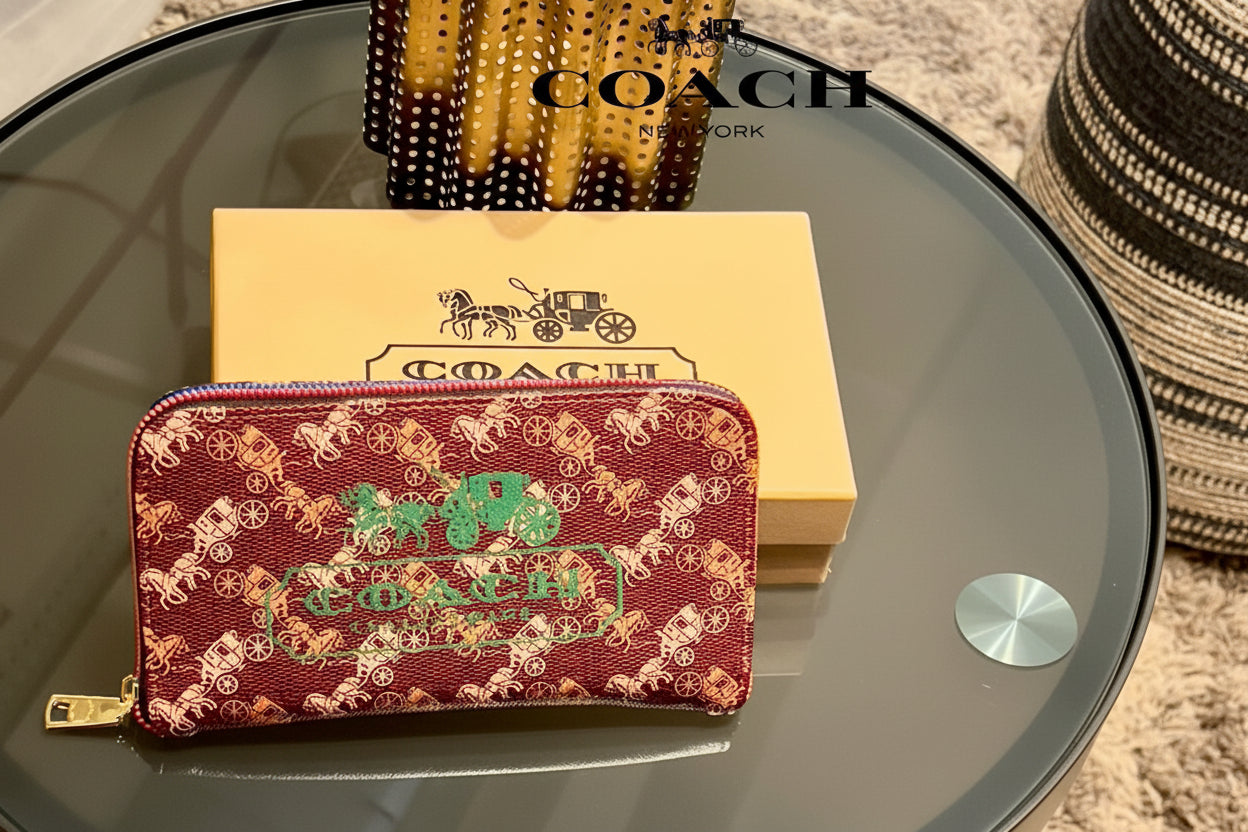 Red Coach Charter Signature Wallets for Women Coach wallet with brand logo on a glass surface