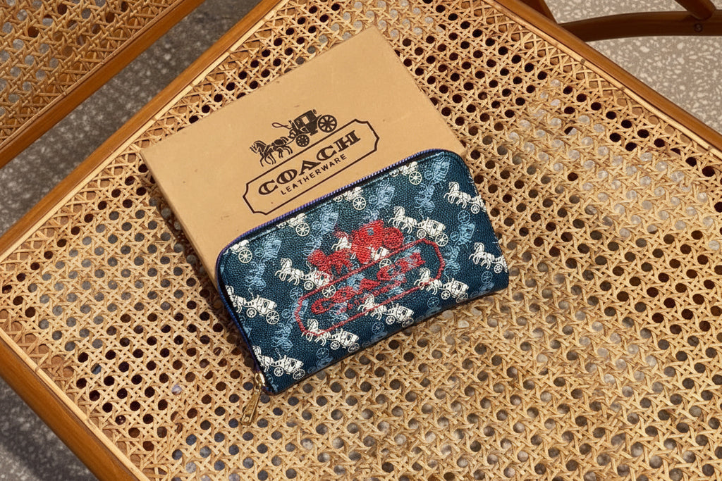 Blue Coach Charter Signature Wallets for Women Coach pouch with decorative design on a woven surface