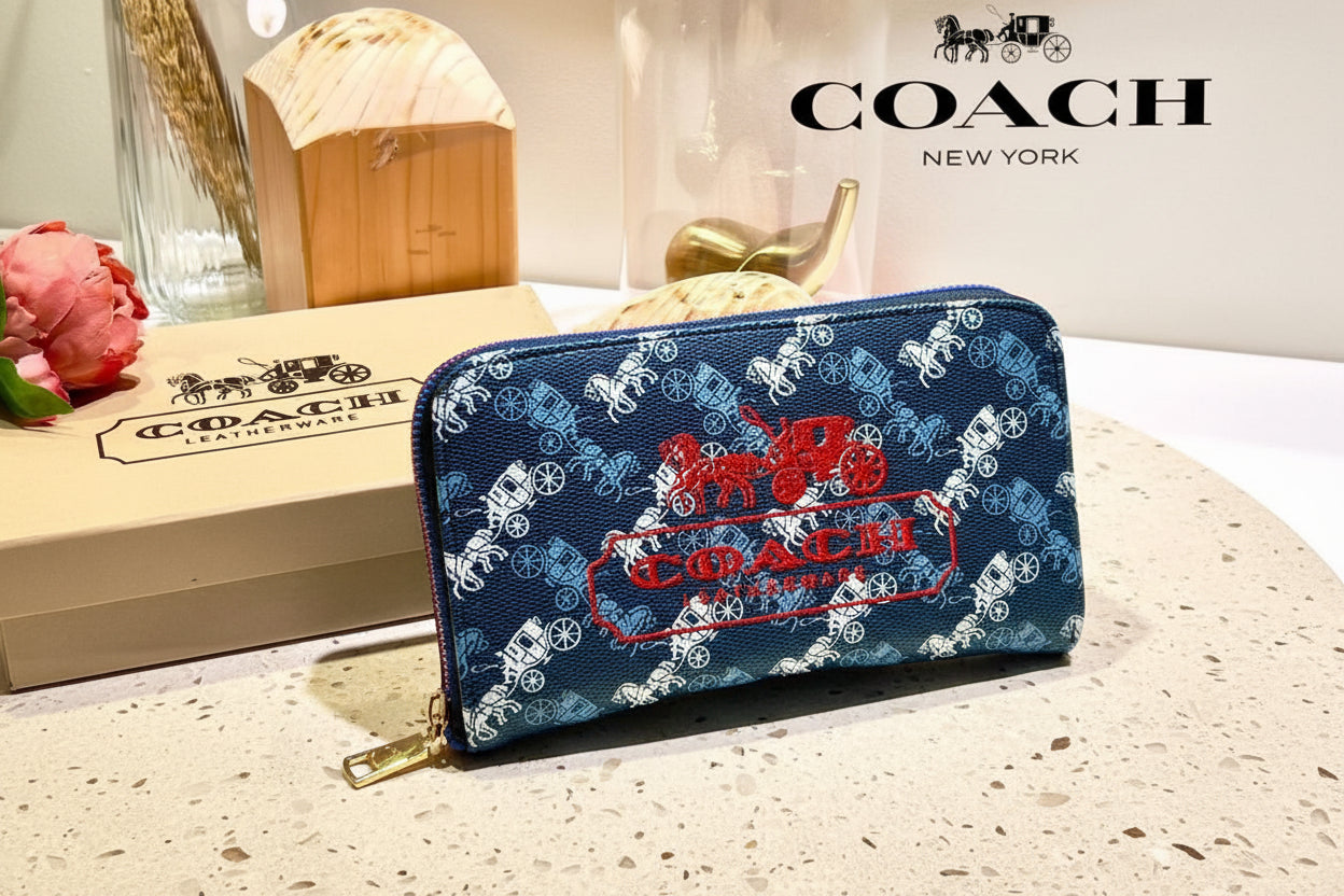 Blue Coach Charter Signature Wallets for Women Coach wallet with horse and carriage design on a white surface with Coach branding.